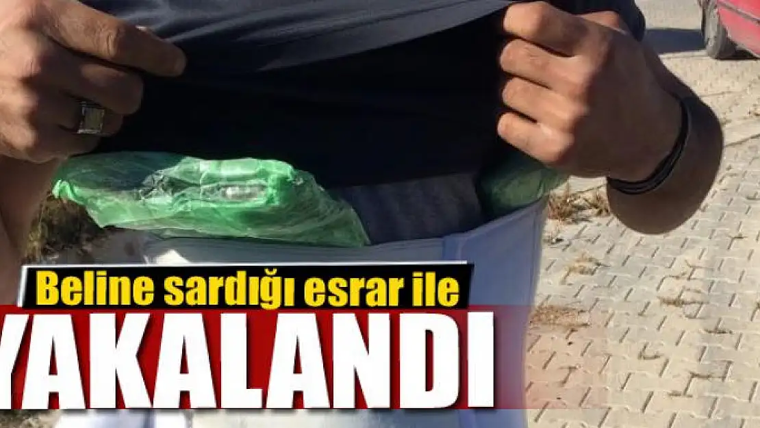 Beline sardığı esrar ile yakalandı