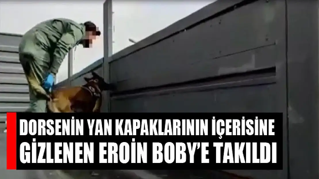 Dorsenin yan kapaklarının içerisine gizlenen eroin Boby'e takıldı