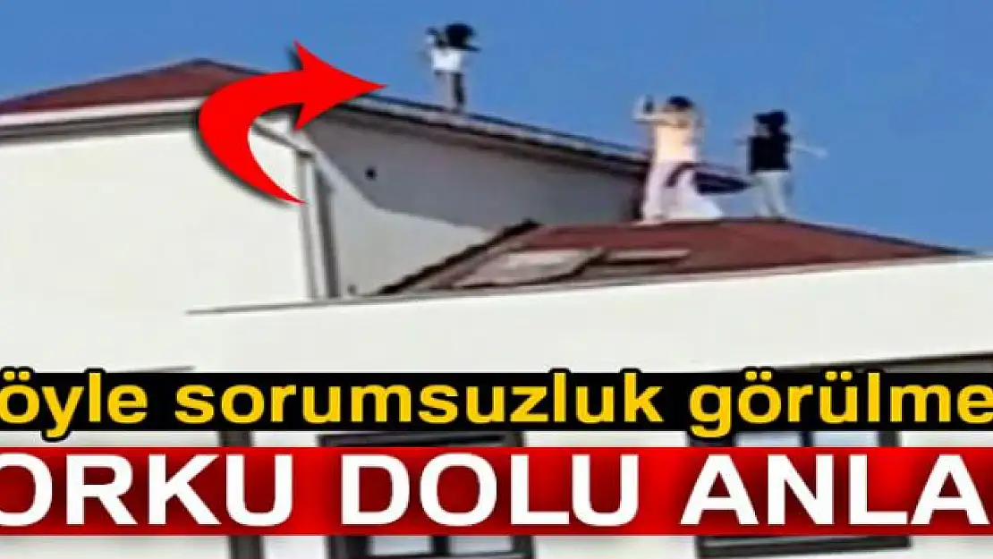 Küçük bir kızı fotoğraf çekmek için çatıya çıkaran sorumsuzlar kamerada