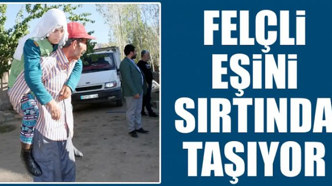 Felçli eşini sırtında taşıyor