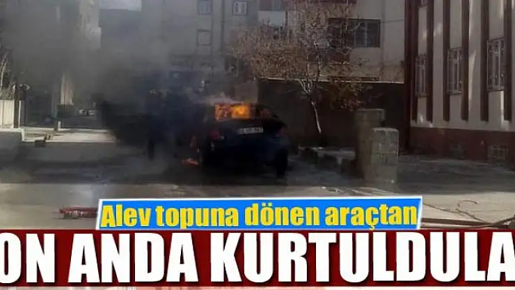 Alev topuna dönen araçtan son anda kurtuldular